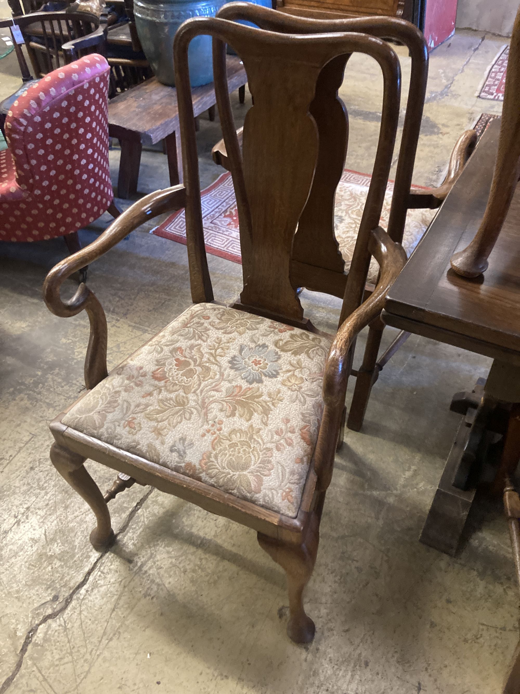 A set of eight 1920s oak Queen Anne-style dining chairs, two with arms